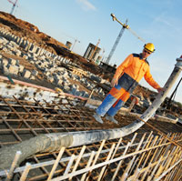 Building Worker Pourning Concrete