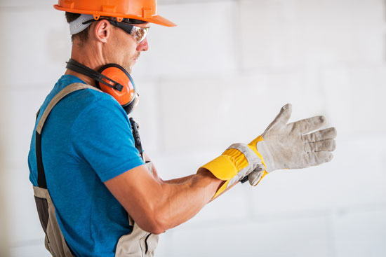 construction worker with gloves and hardhat