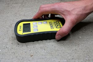 concrete moisture meter testing the slab